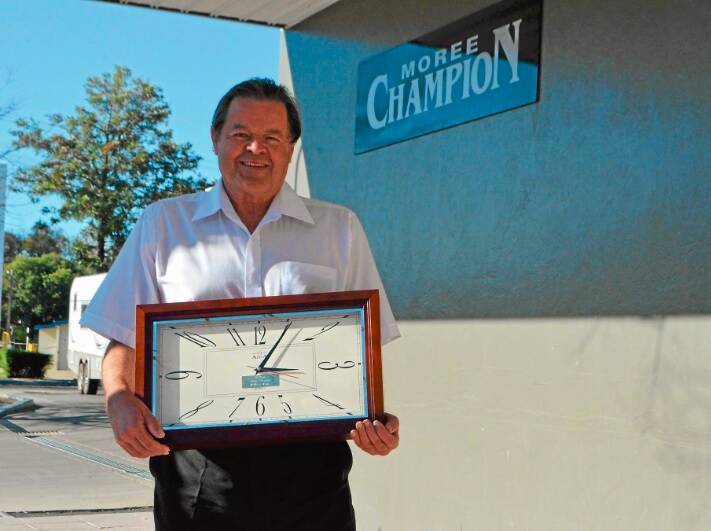 FAREWELL: The late Ron Turton clocked up 25 years at the Champion before his retirement in 2014. This photo was taken in 2013 when he received an engraved clock after reaching 25 years at Moree.