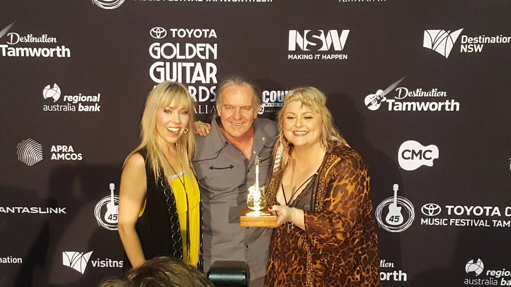 GOLDEN NIGHT: Bennett, Bowtell and Urquhart with one of the two Golden Guitars they picked up at this year's Toyota Golden Guitar Awards.