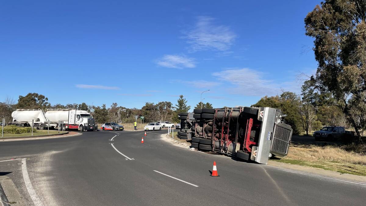 Truck carrying solar panels tips over at Armidale