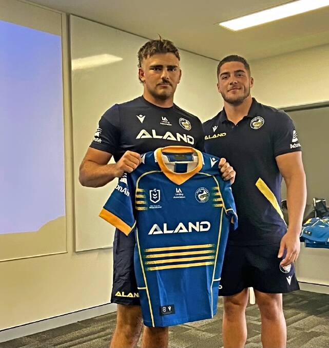 Parry receives his 2023 SG Ball jersey from new Eels signing Matthew Doorey. Picture supplied 