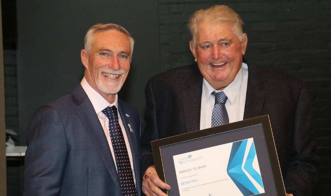 LEGEND: Pay receives his service to sport award at the Inverell Sports Council's 50th anniversary dinner in 2018.