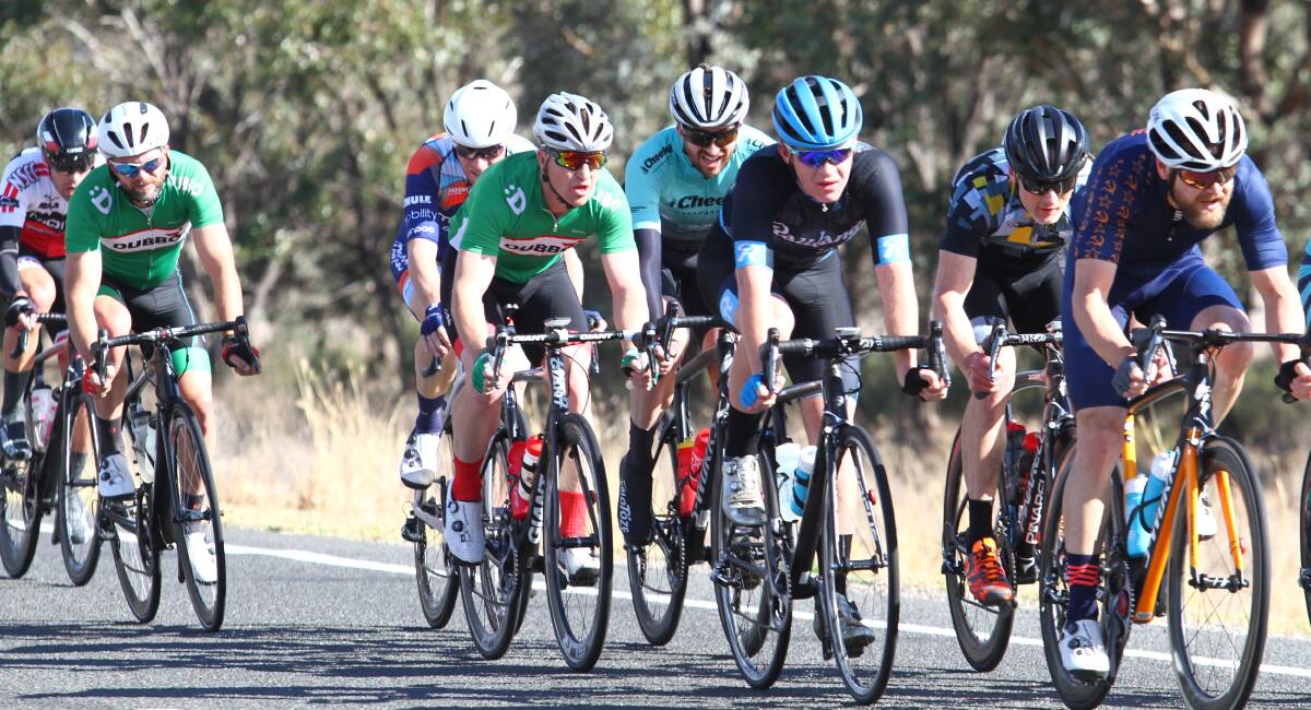 TESTING: Eather, second from the right, deals with a strong crosswind about 30 kilometres from the finish line.