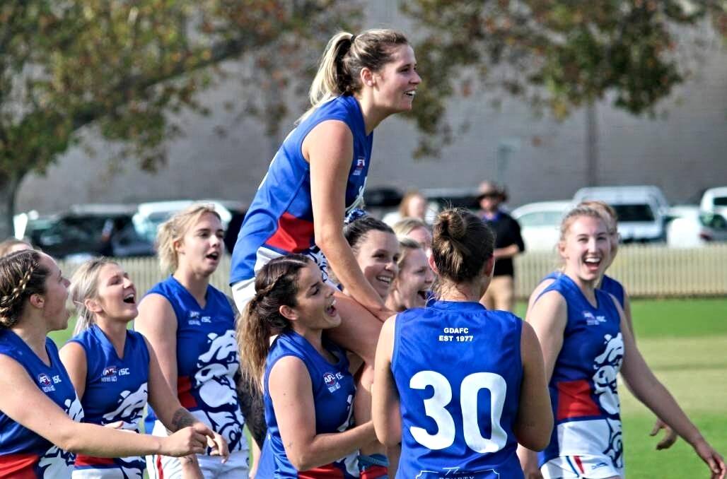 Mitchell is carried off after her last game for the Bulldogs, at No 1 Oval this year. Picture by Zac Lowe