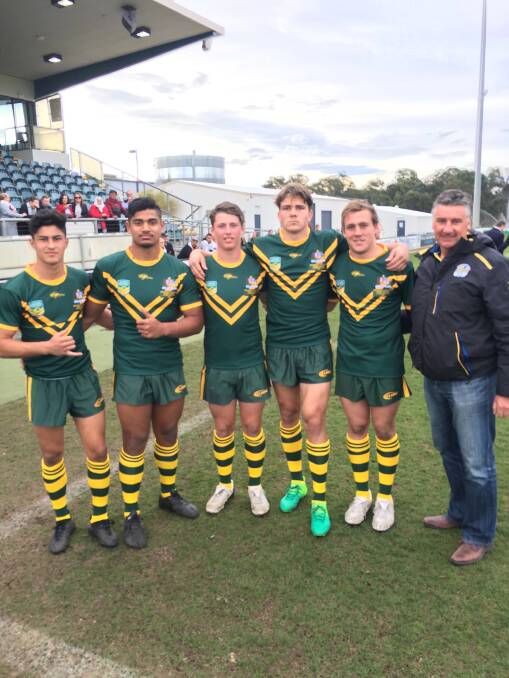 TALENT: Former Oxley High School student Ethan Parry (fourth from left) and the man who scouted him, Anthony Field, with Parry's Eels and Australian Schoolboys teammates.