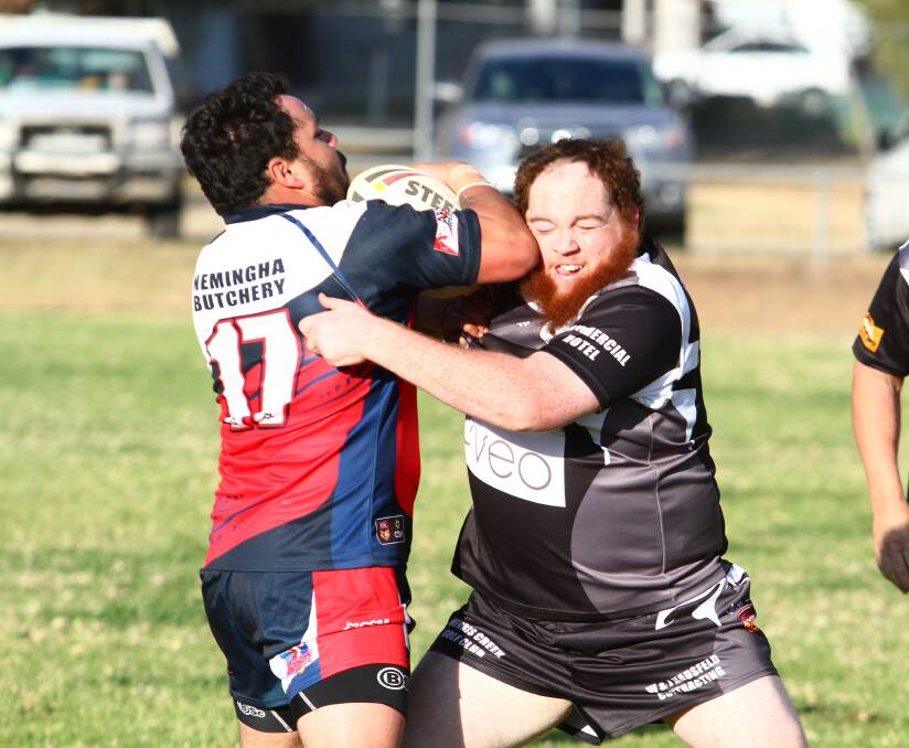 CRUNCH: Roosters replacement Matthew Lillicrap and Magpies replacement Cohal Millgate get close up and personal at the Creek on Saturday.
