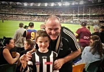 FOOTY FANS: Brad Greenshields, the new AFL competition co-ordinator for northern NSW, and his son Sam. Photo: Supplied