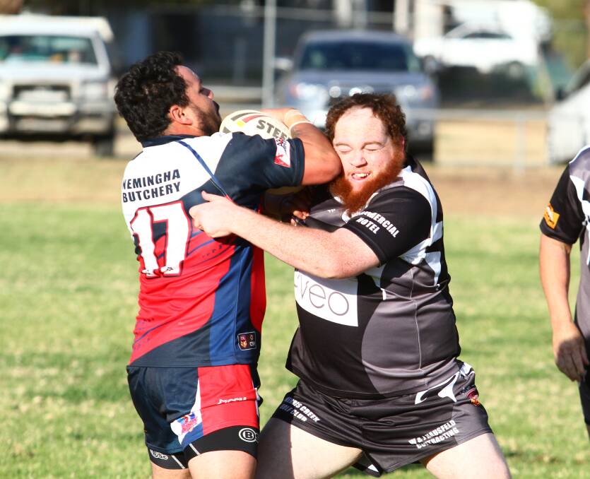CRUNCH: Roosters replacement Matt Lillicrap and Magpies replacement Cohal Millgate get close up and personal at the Creek on Saturday.