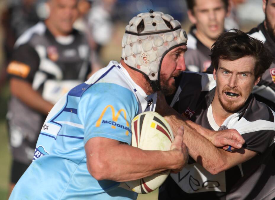 ON A ROLL: Magpies hooker Zac Buckley zeroes in on Blues back-rower Adam Suckling. "We’re coming home strong,” Buckley said after the 42-14 elimination final win. Photo: Mark Bode