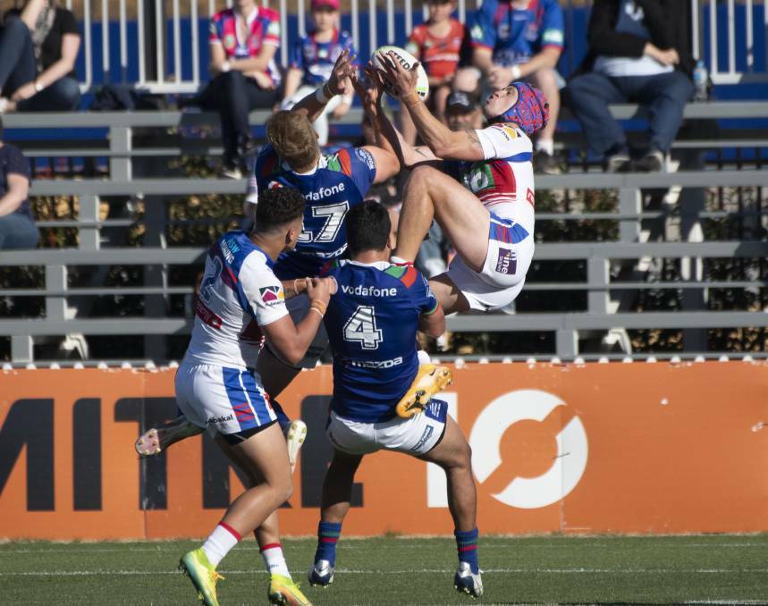 AIRBORNE: Knights fullback Kalyn Ponga flies high at Scully Park last August. Photo: Peter Hardin