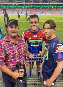 CAPTURED IN TIME: Henderson (centre), his father, Peter, and younger brother, Charlie, after the Knights-Bulldogs trial at Newcastle in February. Photo: Suppled