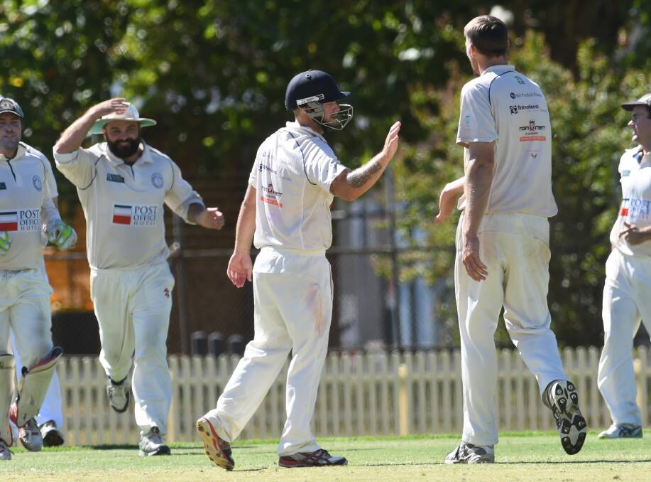 ON A ROLL: Souths celebrate an O'Neill wicket, one of six he took on the day. Photo: Gareth Gardner