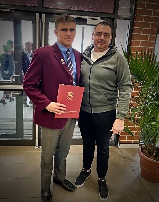  Cody Parry celebrate his high school graduation with his father, Troy. Picture Supplied