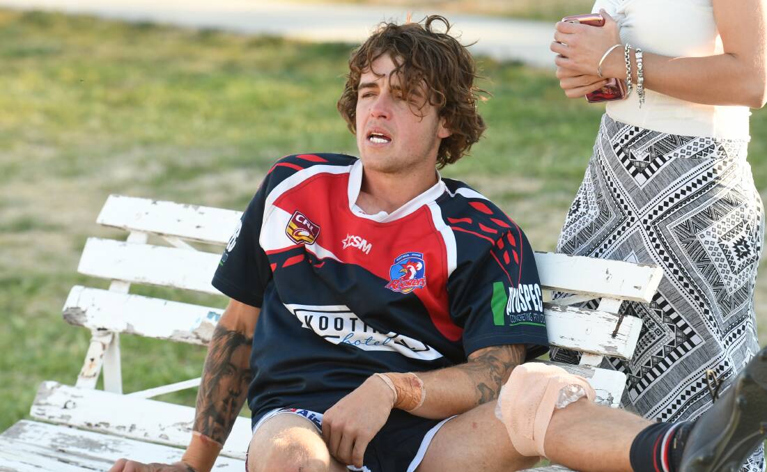 FORLORN: Jordan Sharpe struggles with his emotions after being carried off with a dislocated knee. Photo: Mark Bode