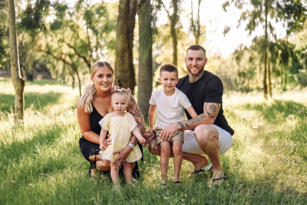 THE CLAN: Roosters centre Ryley Mackay with his fiancee, Sophie Johnson, his son, Korbyn, and Johnson's daughter, Sabrina. Photo: K Summer Photography 