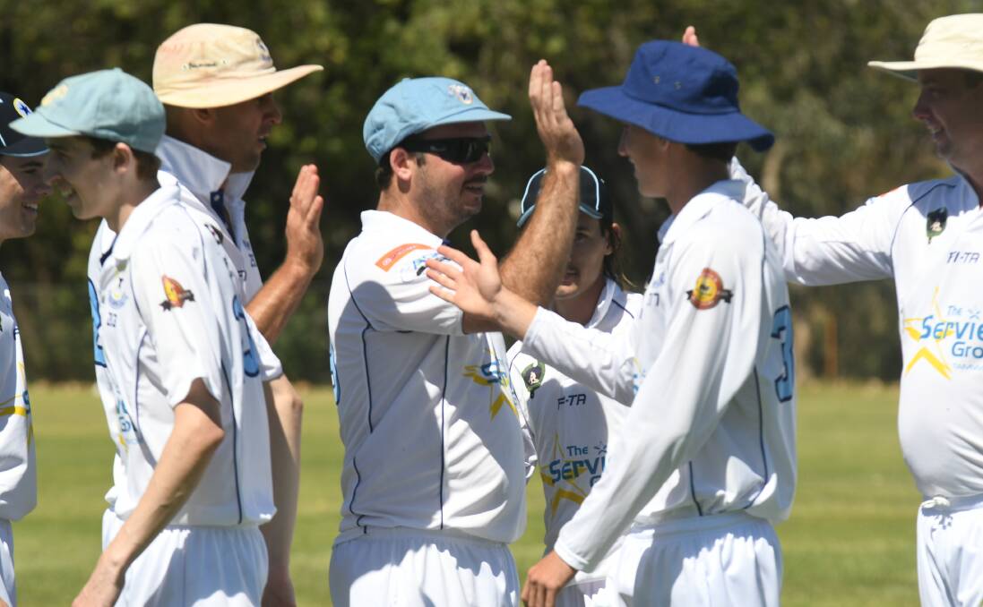 YOU BEAUTY: Old Boys quick Josh Smith (centre) celebrates his career-best bowling performance.
