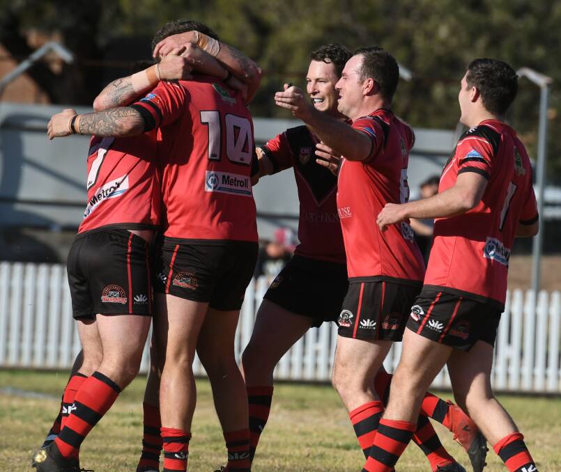 YEAH, BABY!: North Tamworth celebrate Kieran Fisher's try and an unassailable lead over Werris Creek. Photo: Mark Bode