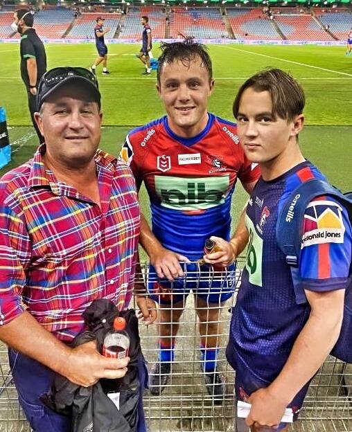 Henderson (centre) with his father, Peter, and younger brother, Charlie, after the Knights-Bulldogs trial at Newcastle this year. Picture suppled