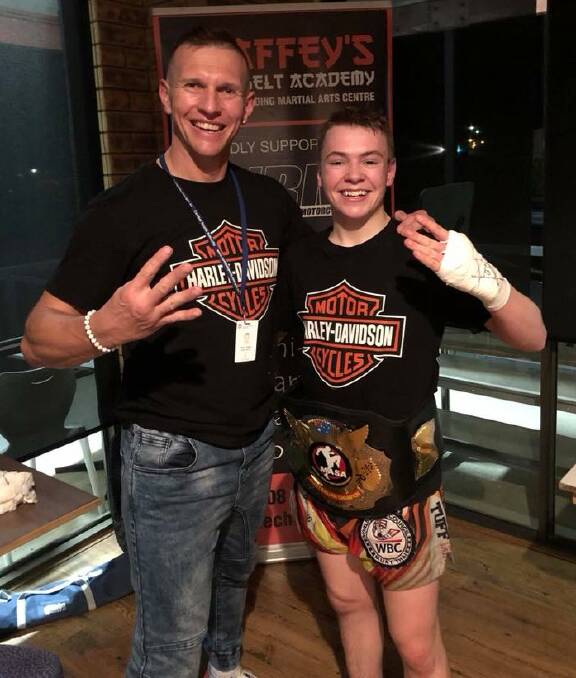 UPWARD SPIRAL: Scott Chaffey and Josh McCulloch celebrate the teen's first Australian title, and his fourth belt, at Morisset on Saturday night. Photo: Facebook