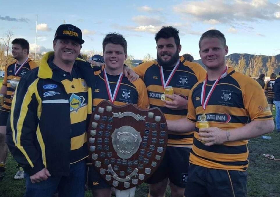 GLORY FLASHBACK: Collins with Steve and his brothers, Andrew and Sam, after Pirates' 2016 premiership win. Photo: Supplied