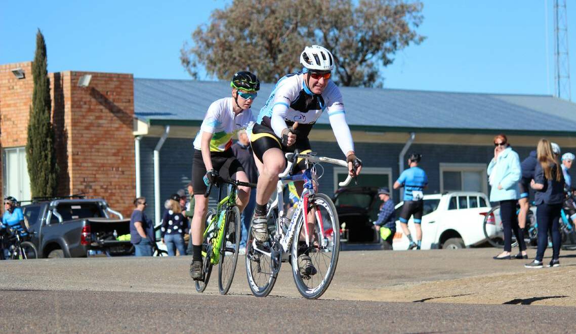 LEARNING CURVE: Noonan shadows Malcolm "Chum" Nash at the 2018 Dewhurst Memorial Handicap Road Race. Nash won and Noonan finished second. Photo: Supplied 