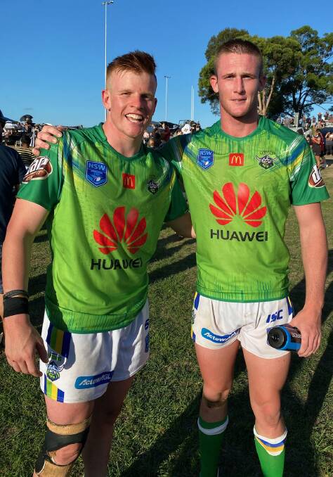 GREEN MACHINES: Raiders teammates Sam Wentworth and Cooper Harris following a Jersey Flegg trial against Wests Tigers at Camden last weekend (Canberra, however, will not field a Jersey Flegg side this season). Photo: Supplied 