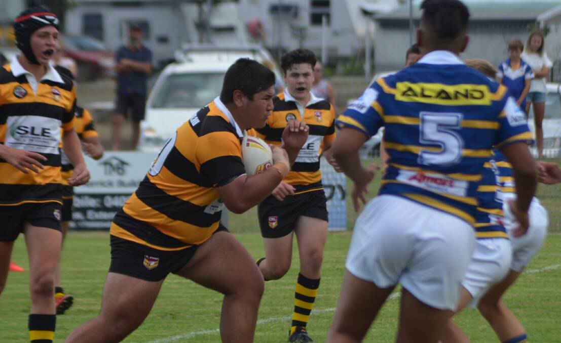 LOCKED AND LOADED: Big Jordan Leota smashes it up for the Tiger under-16s.
