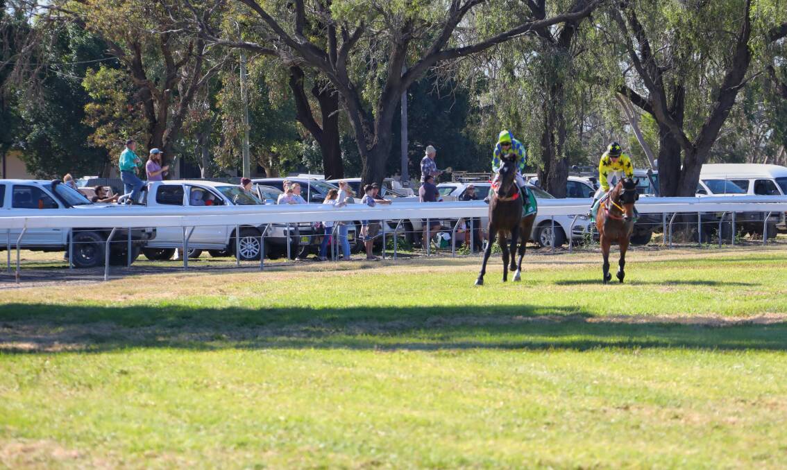 BIRD'S EYE: Onlookers watch, from outside the track, Saturday's picnic meeting at Moree. Photo: Dockerty Photography