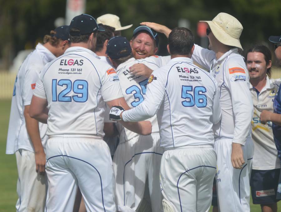 YEAH, BABY!: Norvill is mobbed by teammates after last season's grand final. Photo: Mark Bode