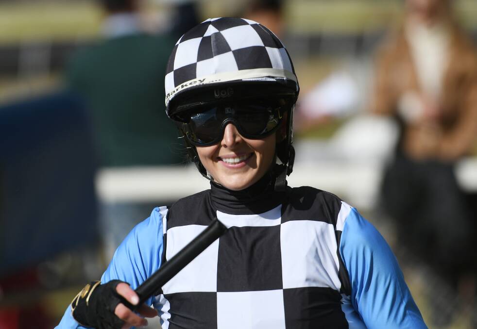 SERIOUS WATTAGE: Apprentice Madeline Owen is radiant after steering the Brett Cavanough-trained Innocent Party to victory in race one at Quirindi on Saturday. Photo: Gareth Gardner