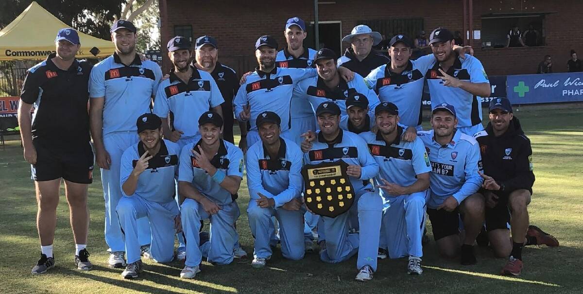 BLUE BOYS: Groth (holding the shield) and his South Tamworth teammate, Tom O'Neill (back centre), celebrate the Bush Blues' Twenty20 final win over Queensland on Saturday. Photo: Facebook