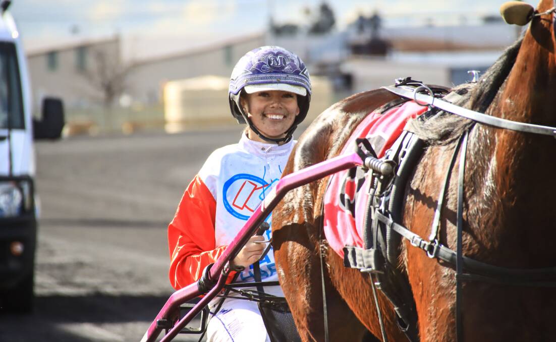DRIVING QUEEN: Tamworth reinswoman Madi Young flashes a winning grim behind Karaoke Rock at Dubbo on Sunday.