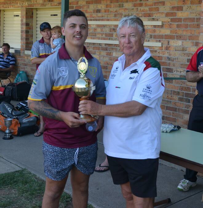 RECOGNITION: Umpire Kevin Miller presents Crowe with his man of the match trophy.
