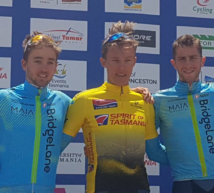 YOU BEAUTY!: Inverell rider Dylan Sunderland has won back-to-back Spirit of Tasmania tours, after safely negotiating the final-stage criterium in Devonport on Saturday. His Team BridgeLane teammates, Chris Harper (R) and Tyler Lindorff finished second and third, respectively. Photo: Twitter.