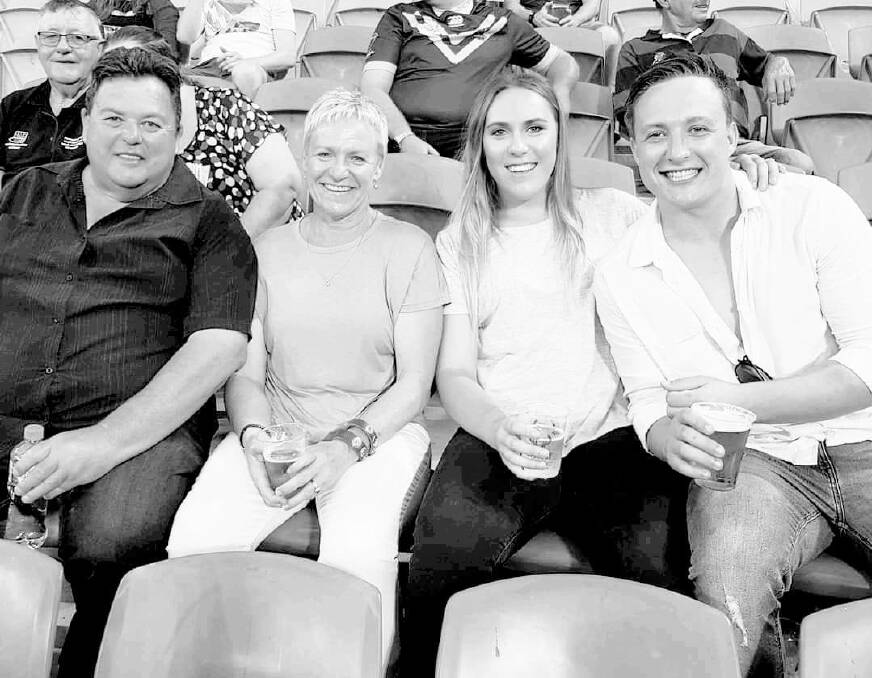 'SADLY MISSED': Jody Cooper with his wife, Vicki, and their children, Georgia and James, at the rugby league World Cup final at Suncorp Stadium in December, 2017.