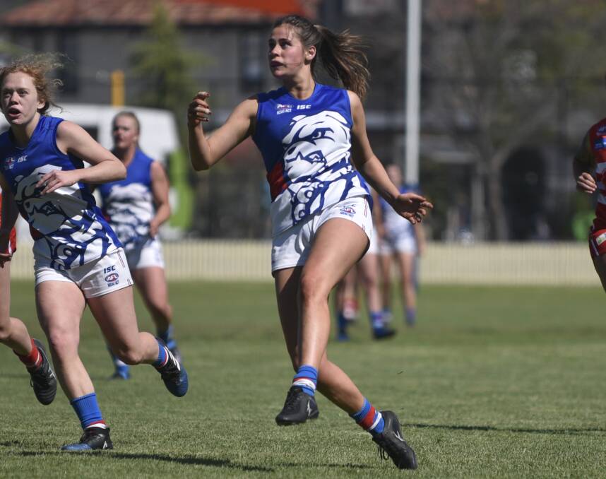 TEEN TALENT: Alice Mitchell en route to being named best on ground in the Bulldogs' grand final win over the Swans. Photo: Mark Bode
