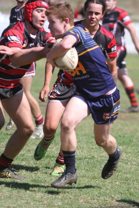 DANGER MAN: Cowboys halfback Lochie Smith proves to be a handful.