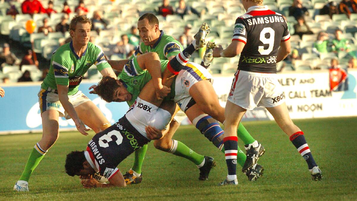 OLD WARRIOR: Tom Learoyd-Lahrs - seen here tacking the Roosters' Craig Wing in 2006 - is excited about the upcoming Legends of League tournament in Gosford. Photo: Gary Schafer 

