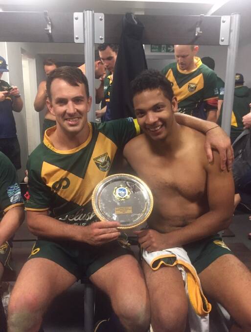SWEET VICTORY: Ford (left) celebrates Hammersmith Hills Hoists' grand final win. 