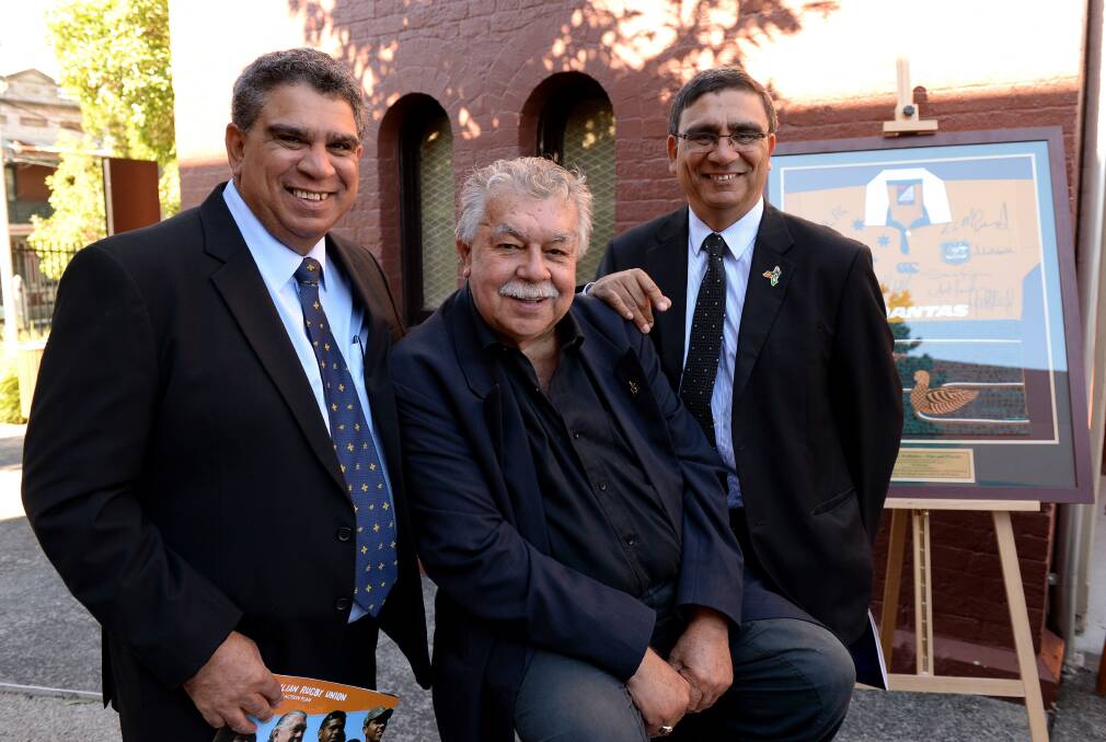 CONNECTED: Gary Ella, right, his brother Mark, left, and Lloyd McDermott - the second Aborigine to play for the Wallabies. 