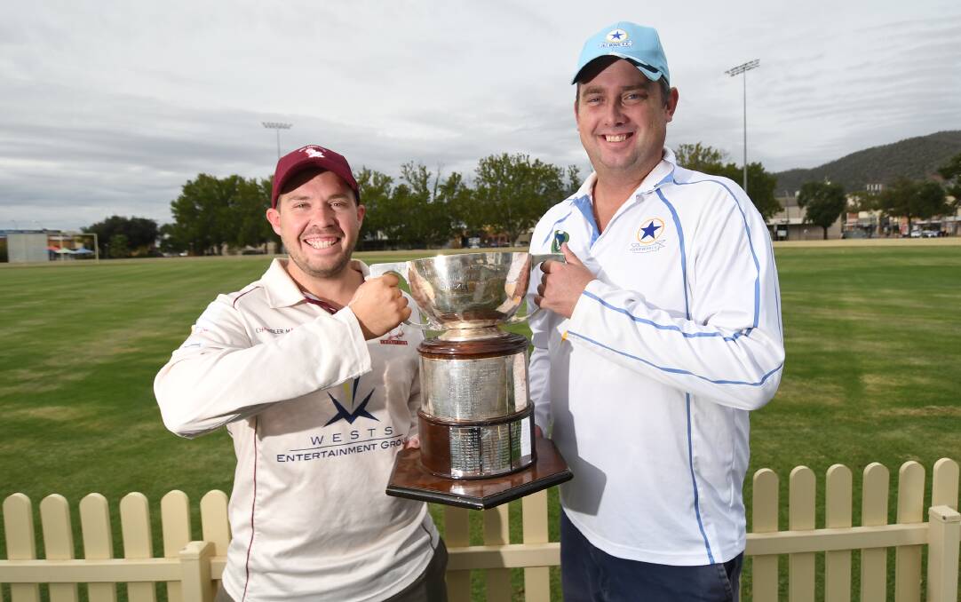 GAME TIME: West Tamworth captain Shaun Stevenson and Old Boys counterpart Ben Middlebrook with the reward for a season's toil under an unforgiving sun. Photo: Gareth Gardner 