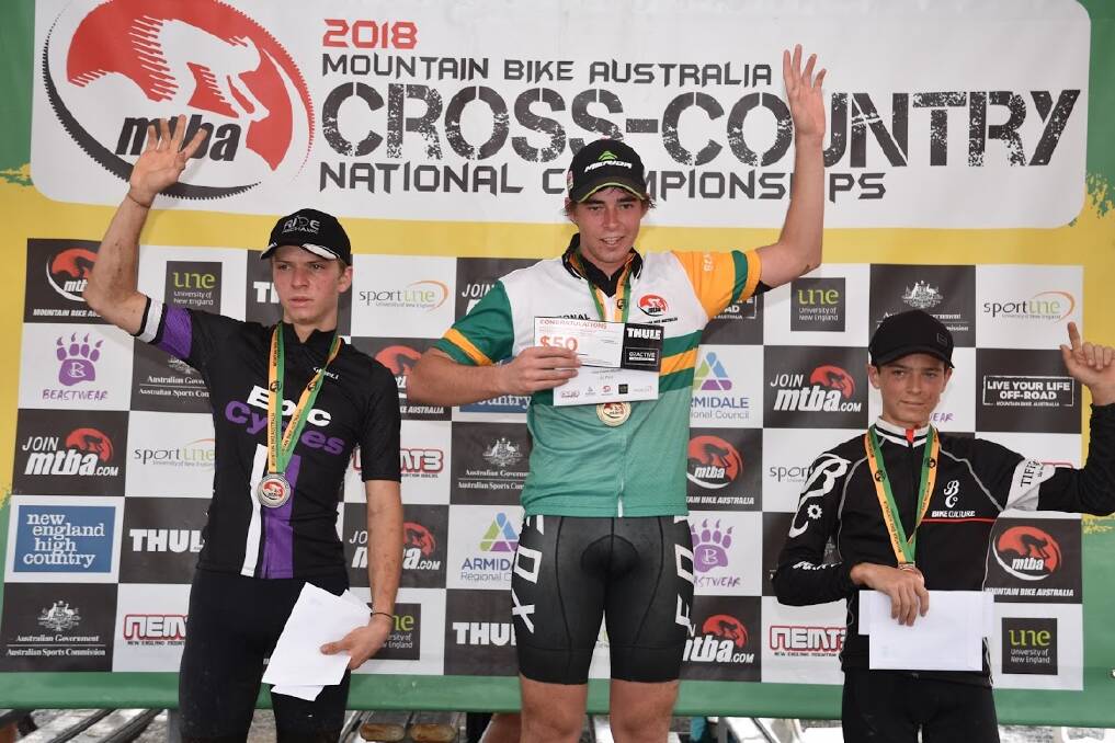 TRIUMPHANT: “I was just so stoked that I actually got it,” Nick Chisholm says of his national championships win. He is flanked by the under-17 runners-up, Momo Frank (left) and Ryan Smith. Photo: Contributed