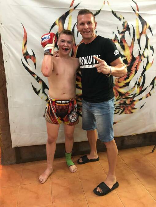ON A ROLL: Josh McCulloch and his trainer, Scott Chaffey, celebrate the teen's knockout win over a Thai on Phuket this week. Photo: Facebook