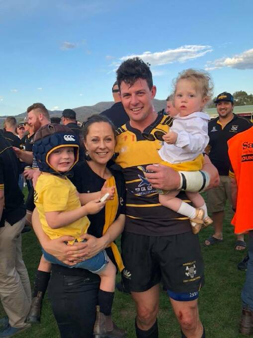THE CLAN: Rixon with his wife, Elle, and their children, Oscar, 4, and Arabella, 1, after Pirates' grand final defeat of Moree on September 15. Photo: Facebook