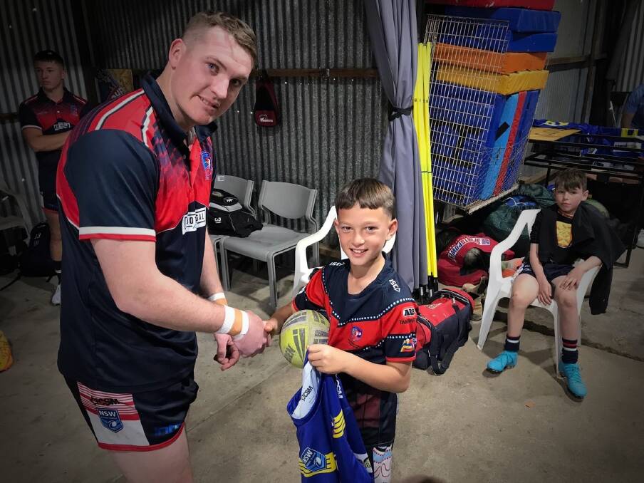 Kooty junior Lachlan Raveneau presents Roosters second-rower Logan Howard with his special Little Wings jersey ahead of Saturday's clash against Werris Creek. Picture: Facebook
