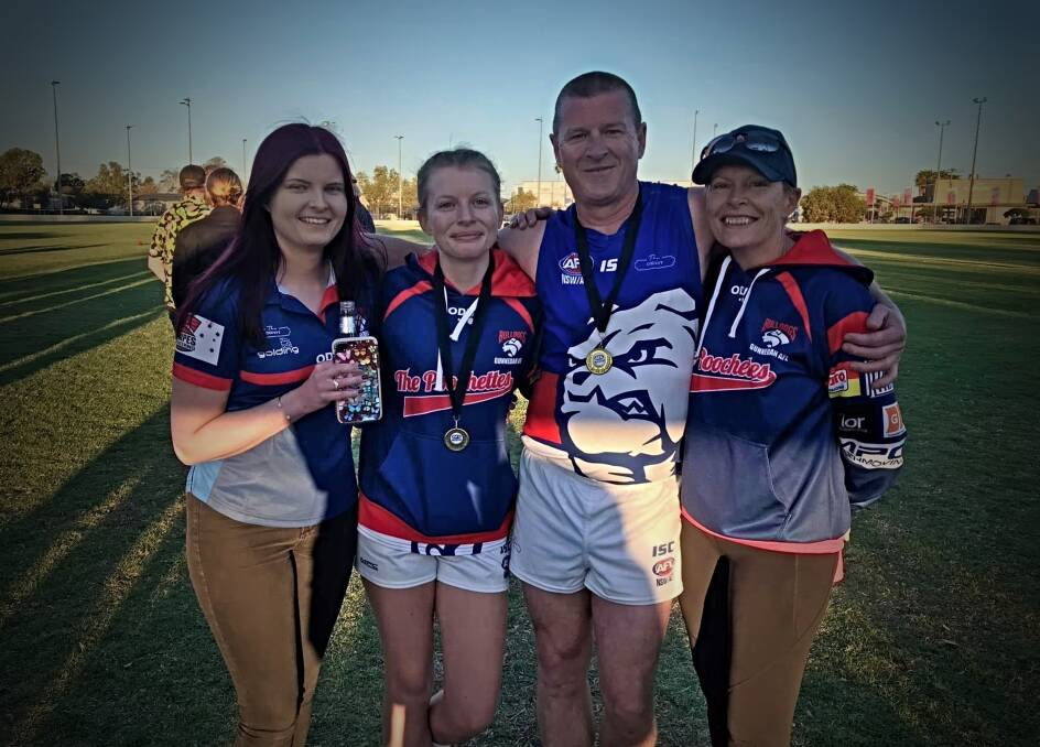 THE EWINGTONS: Kelly, Laura, Mark and Nerieda after Laura and Mark won premierships with the Bulldogs in 2020. Photo: Facebook