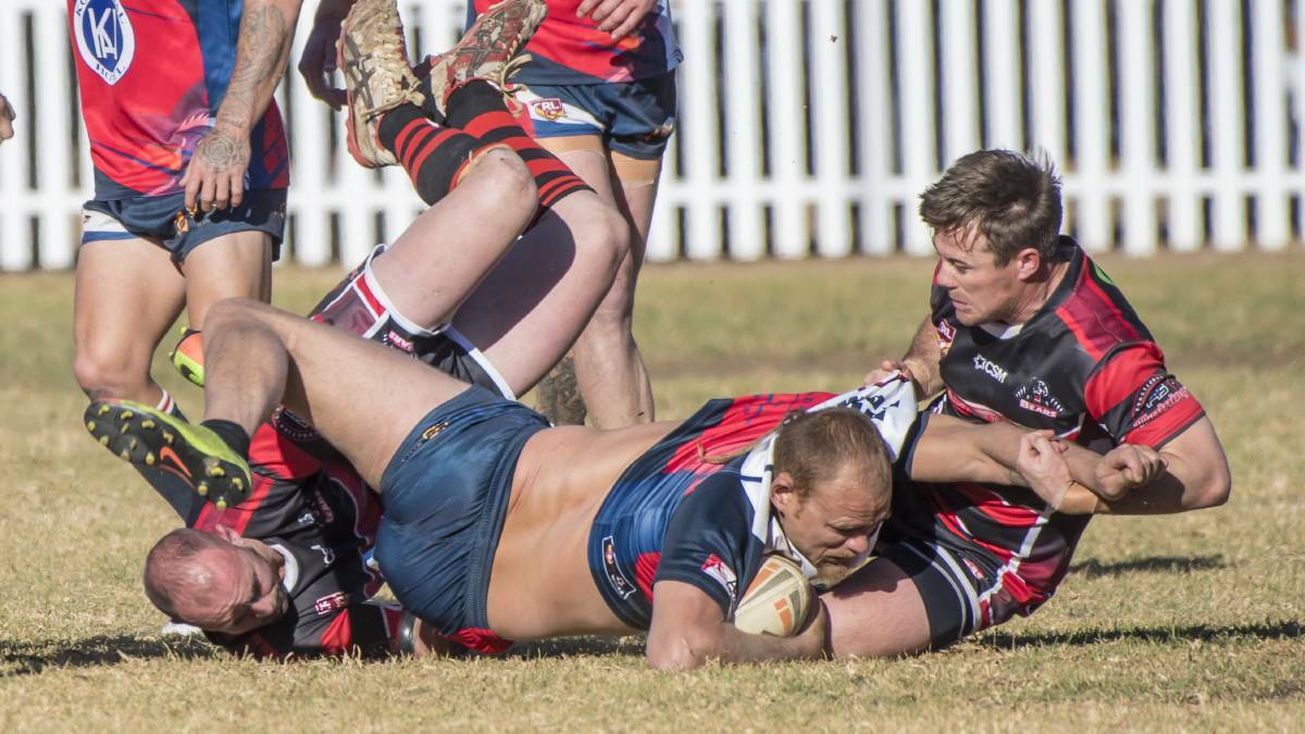 TOUGH AS TEAK: Fisher and Blues prop Daniel Jobson collide earlier this year at Jack Woolaston Oval.