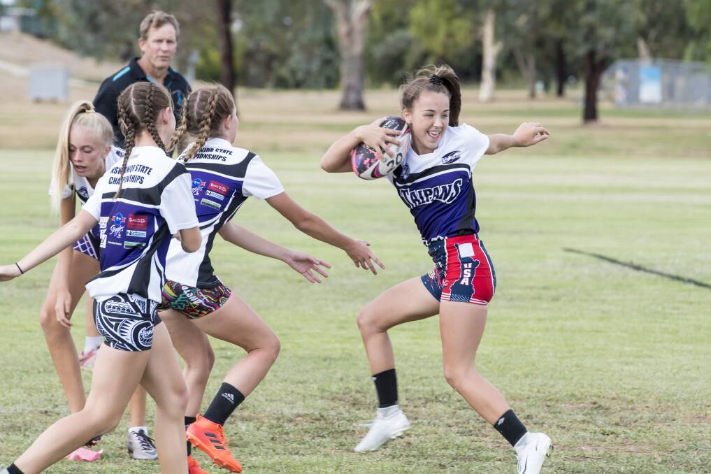 A HOOT: Jada Taylor, of the 15-years girls team, has fun at training before the junior state cup in Coffs Harbour. Photo: Peter Hardin 