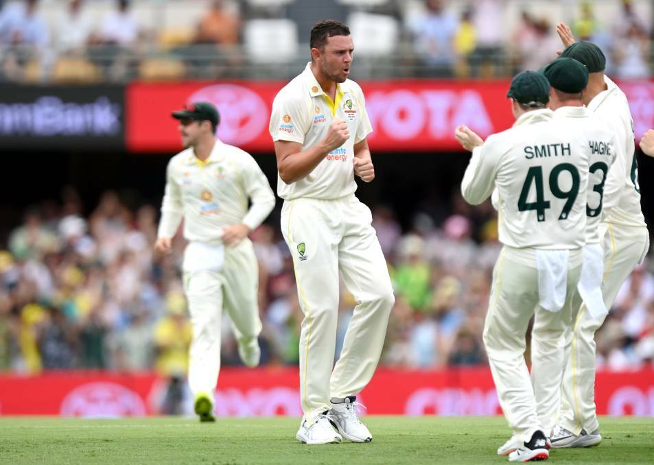 PUMPED: Josh Hazlewood celebrates Joe Root's wicket on day one of the first Ashes Test. Photo: Bradley Kanaris/Getty Images