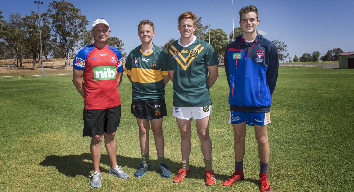 KNIGHT TIME: Troy Pezet, the Knights' elite pathways recruitment manager, with Farrer students Kye Jackson, Sam Wentworth and Jordan Butler. Photo: Peter Hardin