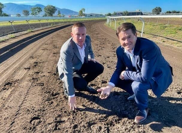 CASH INJECTION: Tamworth Jockey Club general manager Michael Buckley (left) and Member for Tamworth Kevin Anderson. 